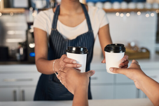 Barista, hands and customer with coffee order in cafe for takeaway, retail sale and hospitality service. Small business, waitress and serving latte beverage by counter in bistro for caffeine drink