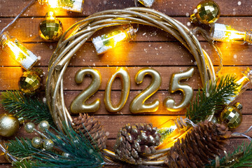 Happy New Year wooden numbers 2025 on cozy festive brown wooden background with sequins, snow, lights of garlands. Greetings, postcard. Calendar, cover