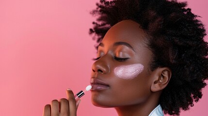 Fototapeta premium Model with radiant skin using a facial serum