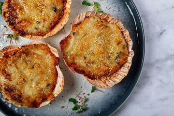 scallop shells, stuffed, baked with cheese, in the oven, julienne with scallops,