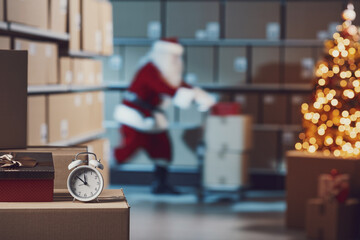Santa Claus in the warehouse on Christmas Eve