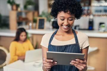 Coffee shop, woman and tablet with waitress, apron and digital check for customer order online. Smile, cafe and restaurant with technology of small business owner or barista with website sales on app