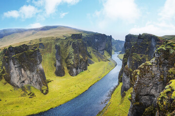 Unique landscape of Fjadrargljufur in Iceland. Top tourism destination. Fjadrargljufur Canyon is a massive canyon about 100 meters deep, located in South East of Iceland.