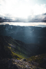 Today, the sun is brightly shining through the clouds over the mountains