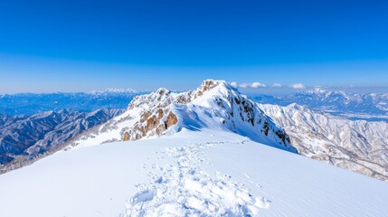 Kasprowy Wierch mountain peak at winter. Amazing snow-capped mountain range in Poland's Tatra Mountains.