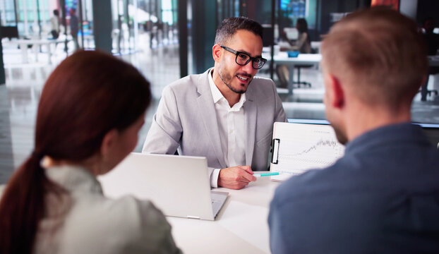 Couple Meeting With Stock Market Finance Investment