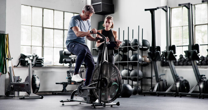 Cardio Workout In Gym On Elliptical Bike Machine