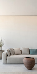 Modern living room with minimalist design showcasing a light sofa and decorative elements