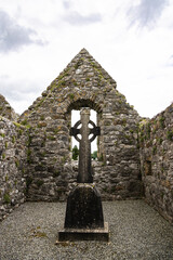 celtic cross in cemetery ruins