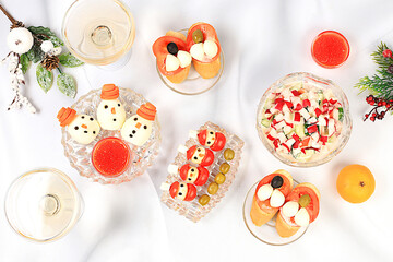 Christmas New Year dishes, detox diet concept, sauerkraut, traditional vegetable salad of cucumbers, tomatoes and radishes, pickles and caprese bruschetta, healthy lifestyle 