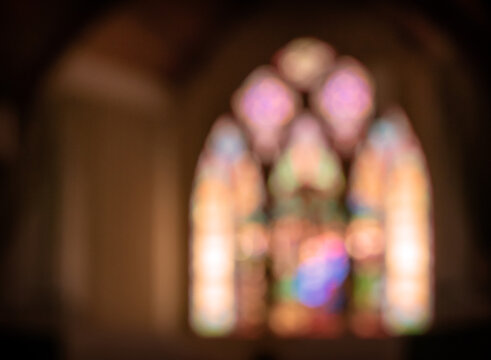 arched stained glass window blurred, bokeh, soft focus effect