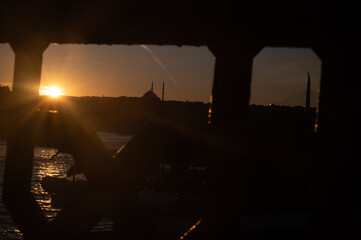 Magical sunset over the Bosphorus, captured from the historic Galata Bridge in Istanbul. Perfect for travel, postcard, and social media.