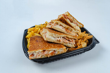 Close up of chicken shawarma meal with lettuce, tomato and onion on white background.
