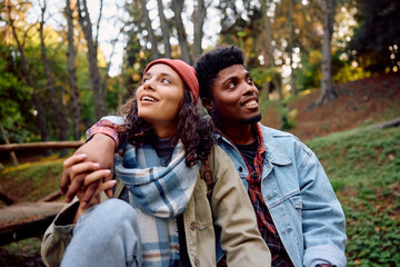Young couple in love enjoying in autumn in park.