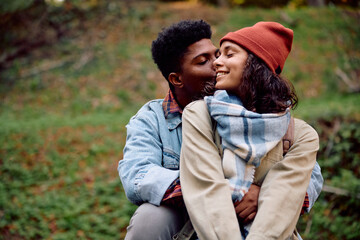 Fototapeta premium Young couple in love during autumn day in park.