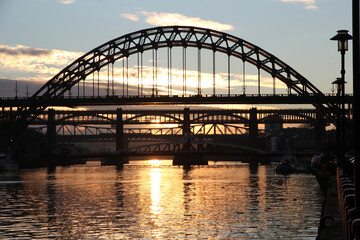 Golden sunset and reflection of Newcastle Upon Tyne’s famous bridges