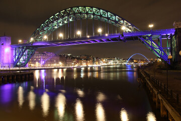 Newcastle Upon Tyne Quayside and Tyne Bridge brightly illuminated