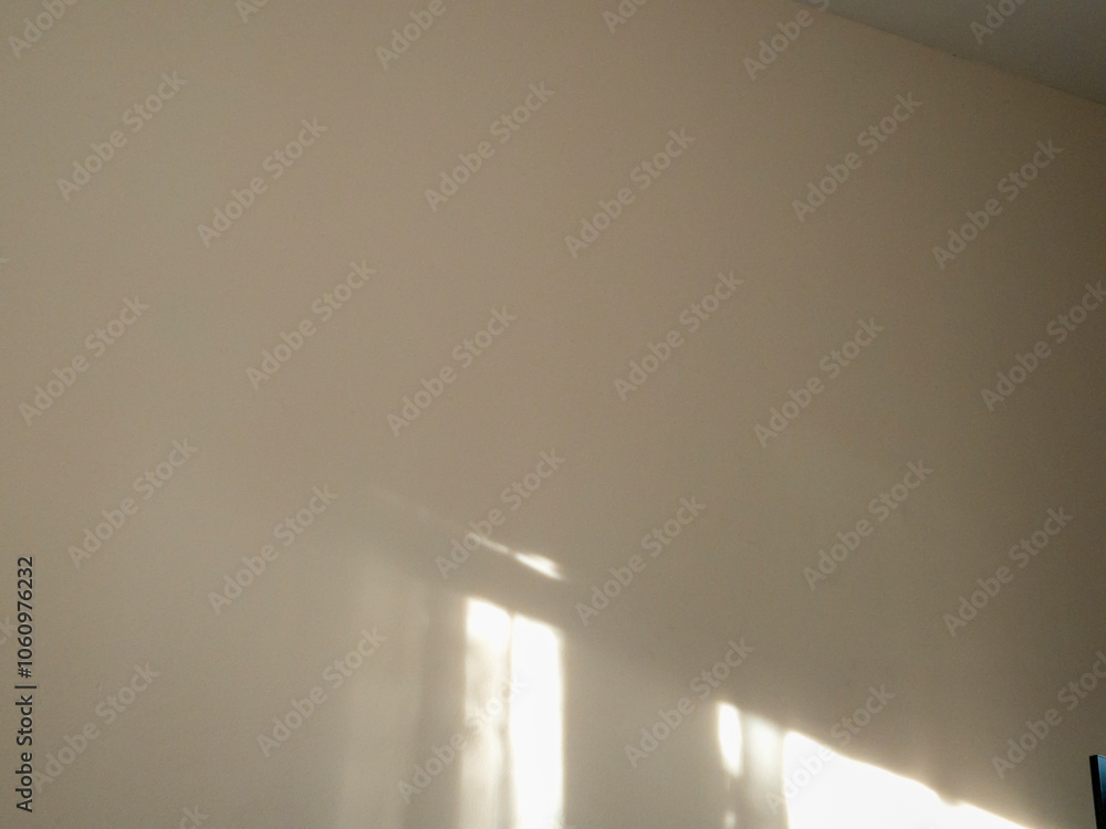 Aufkleber bright plain wall with soft lighting creating a calm atmosphere, ideal for minimalistic backgrounds 
