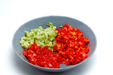 Bowl of Chopped Vegetables on White Background
