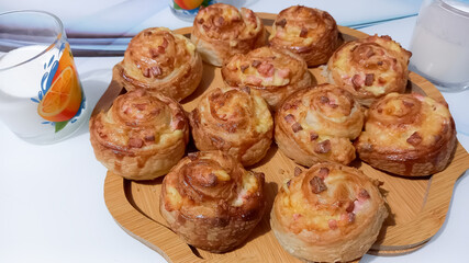 Puff pastry buns baked with sausage and cheese