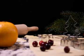 Christmas baking. Gingerbread dough in the shape of a Christmas tree, an angel, a star. Festive...