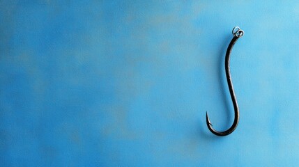 A Single Curved Fishing Hook on a Blue Background