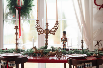 Beautiful Christmas interior. A table and a Christmas tree, a festive table. decoration