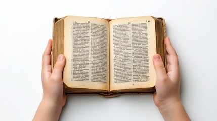 A pair of hands holding an open Bible with visible text on the pages against a plain white background