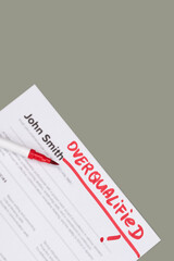 Fake mock CV (curriculum vitae) for John Smith, rejected by HR as not the right Overqualified candidate. Concept of job search, hiring mismatch, recruitment process, and rejection. 