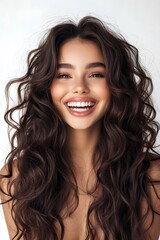 Beauty brunette laughing young woman with long shiny curly hair on white background