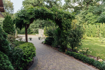 Beautiful summer garden with a walkway winding its way through