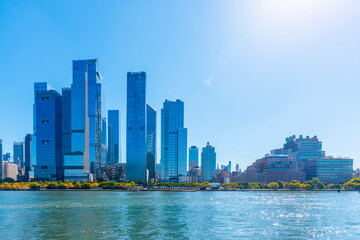 Naklejka premium Skyscrapers in Midtown Manhattan seen from Hudson River on a sunny morning