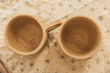 Cropped shot of unrecognizable child making ceramic mug at pottery class