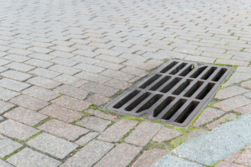flood water storm street manhole sewer sewage sewerage road drain grate rain drainage