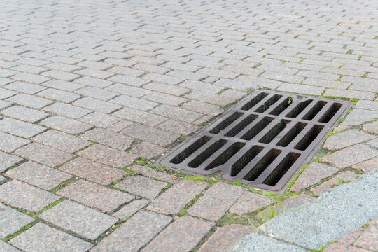 flood water storm street manhole sewer sewage sewerage road drain grate rain drainage