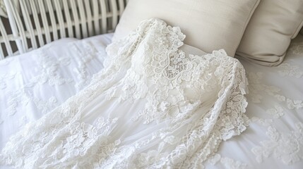 Elegant Lace Bridal Gown on Soft Bedspread