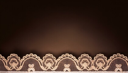 Delicate white lace trim against a dark brown background.