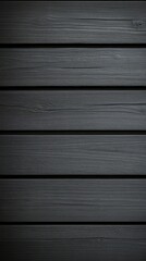Obraz premium Black wooden planks arranged horizontally on a smooth surface