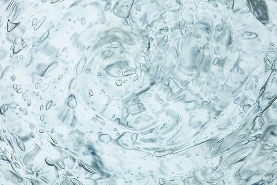 Cream gel blue gray colored transparent cosmetic sample texture on white background..