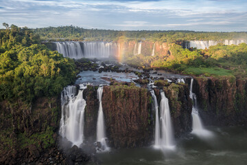 Majestic Iguazu waterfalls with rainbow in Argentina