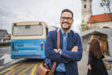 Portrait of businessman wait transportation on the bus station