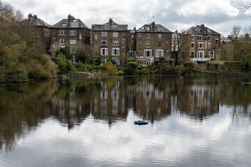 View on urban park Hampstead Heath with ponds, hills and view points, North London, UK