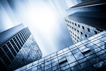 Captivating Skyward View of Modern Skyscrapers Against a Dreamy Blue Sky