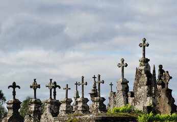 Set of crosses with gray sky behind, religion, cemetery, halloween, scary environment