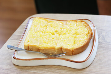 plate of toast on wood table.