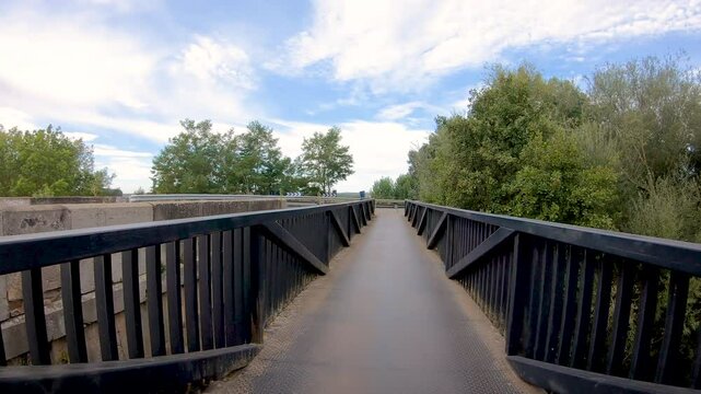 French Way of Saint James - pedestrian bridge over Tuerto river leaving San Justo de la Vega, province of Le&oacute;n, Castile and Leon, Spain
