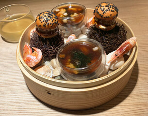 Seafood exquisite dish with shrimps and sea urchins beautiful presentation