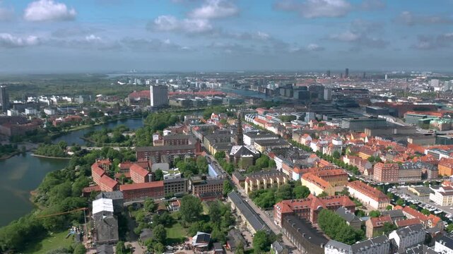 Summer skyline cityscape of Indre By, Copenhagen, Denmark: Christianshavn and Freetown Christiania districts. Wide panoramic aerial view