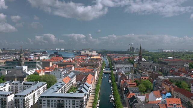 Summer skyline cityscape of Indre By, Copenhagen, Denmark: Christianshavn and Freetown Christiania districts. Wide panoramic aerial view