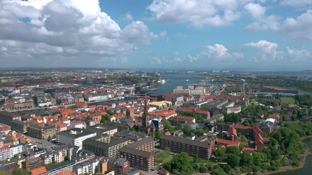 Summer skyline cityscape of Indre By, Copenhagen, Denmark: Christianshavn and Freetown Christiania districts. Wide panoramic aerial view